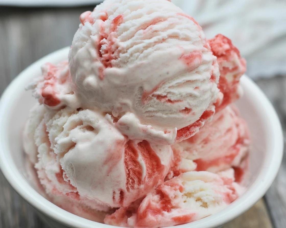 Homemade strawberry shortcake ice cream bars with fresh strawberries and creamy texture.