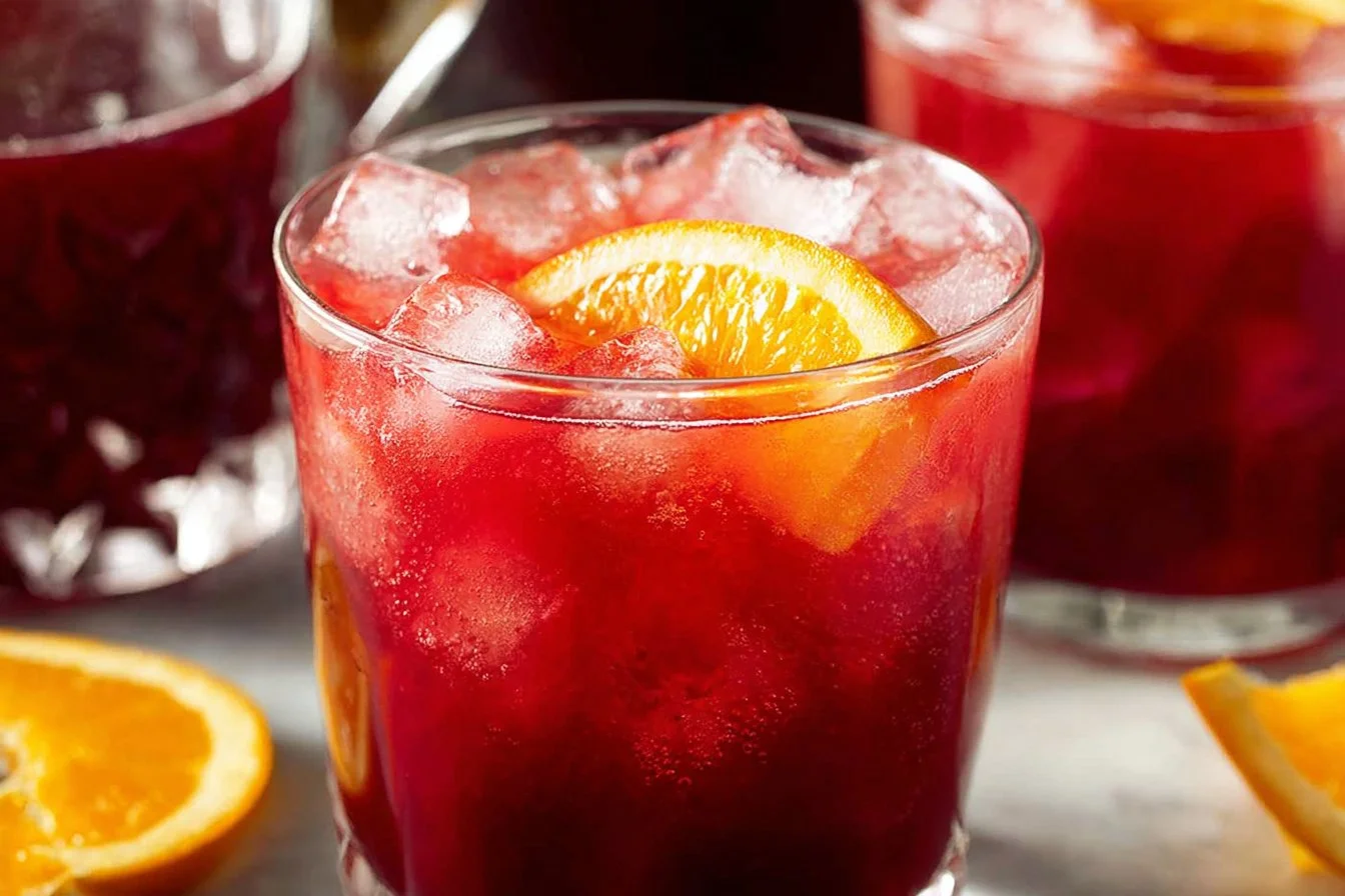 Festive Christmas Morning Punch served in a holiday-themed glass.