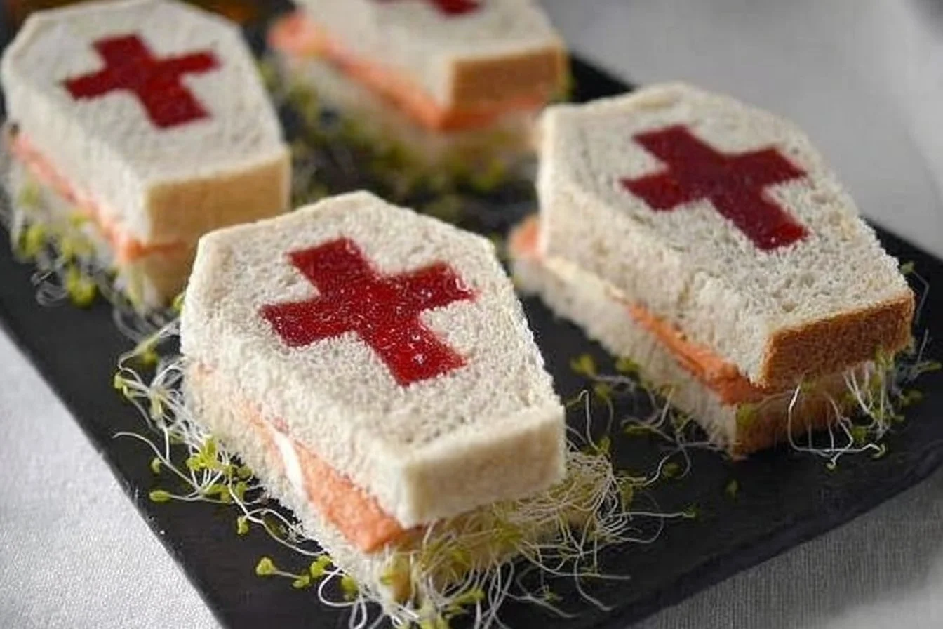 A spooky coffin sandwich shaped like a coffin, perfect for Halloween parties.
