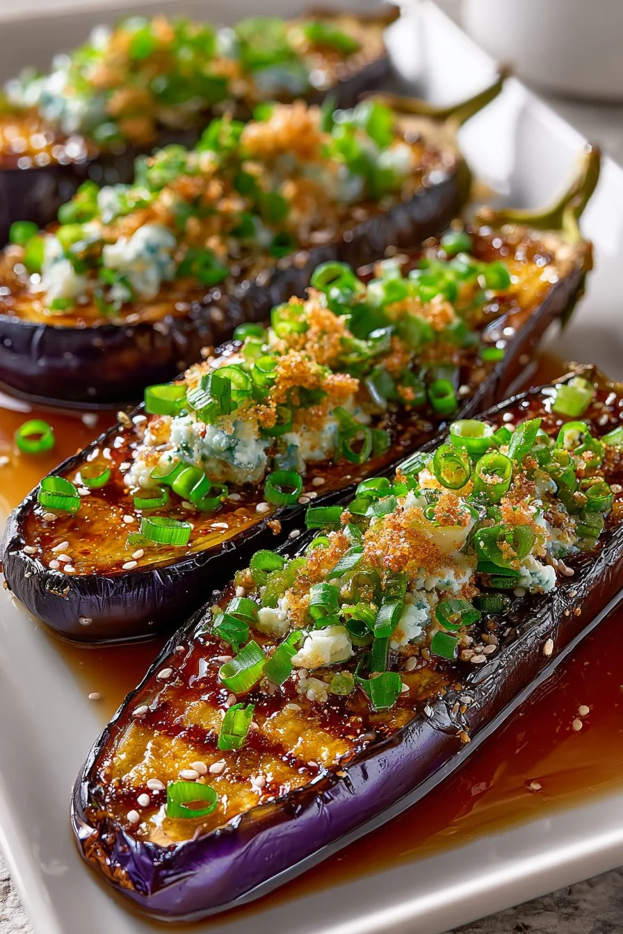 Delicious roasted garlic and ginger Japanese eggplant dish garnished with herbs